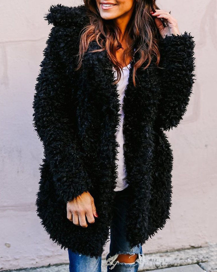 Oversized black faux fur fleece coat with shaggy texture, long sleeves, open front