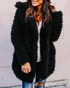 Oversized black faux fur fleece coat with shaggy texture, long sleeves, open front