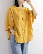 Yellow lantern-sleeve loose shirt with round neck and button front
