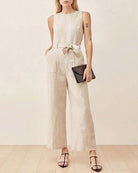 Sleeveless tie-waist pocket jumpsuit in light beige, wide-leg wide shoulder fit