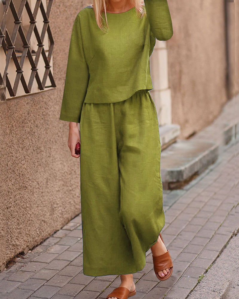 Green long-sleeve two-piece set: layered top and wide-leg pants