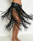 Black PU wrap skirt with sweeping fringe, studded waist belt and thigh slit